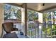 Balcony with railing overlooking green space, offering a relaxing outdoor seating area at 1390 Oak Hill Dr # 206, Dunedin, FL 34698