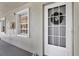Close-up of the front entrance, highlighting the screen door and the decorative wreath, creating a welcoming appeal at 1390 Oak Hill Dr # 206, Dunedin, FL 34698