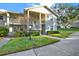 Charming condo showcasing well-maintained landscaping and a welcoming front entrance with dual balconies at 1390 Oak Hill Dr # 206, Dunedin, FL 34698