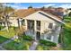 Two-story exterior of the home with balconies, manicured lawn and mature landscaping at 1390 Oak Hill Dr # 206, Dunedin, FL 34698