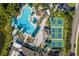 Aerial view of the community amenities, with a large pool and pickleball courts visible at 1416 Leland Dr # 49, Sun City Center, FL 33573
