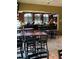 The spacious bar area features multiple tables, chairs, and televisions for an enjoyable social experience at 1416 Leland Dr # 49, Sun City Center, FL 33573