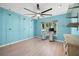 Bedroom features a built-in desk, ceiling fan, and ample closet space at 1416 Leland Dr # 49, Sun City Center, FL 33573