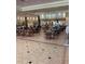 View of tables and chairs set up in a spacious and well-lit common area at 1416 Leland Dr # 49, Sun City Center, FL 33573
