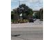 Exterior shot of a gated entrance with palm trees and an American flag at 1416 Leland Dr # 49, Sun City Center, FL 33573