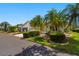 Well-maintained home exterior showcasing a driveway, garage, and lush landscaping for curb appeal at 1416 Leland Dr # 49, Sun City Center, FL 33573