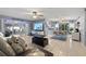 Spacious living area with modern decor, tile floors, and views of the patio providing a bright atmosphere at 1416 Leland Dr # 49, Sun City Center, FL 33573