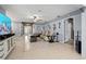 Open concept living area featuring tile flooring, wainscoting, and an open floorplan at 1416 Leland Dr # 49, Sun City Center, FL 33573
