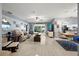 Open living room with tile flooring, ceiling fan, and comfortable seating perfect for entertaining or relaxing at 1416 Leland Dr # 49, Sun City Center, FL 33573