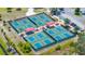 Aerial view of the community's multiple, well-maintained pickleball courts and adjacent parking area at 1416 Leland Dr # 49, Sun City Center, FL 33573