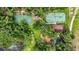 Aerial view of the property highlighting the basketball and tennis courts surrounded by lush landscaping at 16804 Windsor Park Dr, Lutz, FL 33549