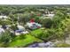 Beautifully landscaped property featuring pool, enclosed patio, and fenced yard at 16804 Windsor Park Dr, Lutz, FL 33549