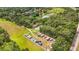Expansive aerial view showing the house location and an RV and boat storage area with many RVs and boats at 16804 Windsor Park Dr, Lutz, FL 33549