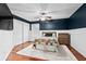 Charming bedroom with stylish navy accent wall, closet, and beautiful natural light at 16804 Windsor Park Dr, Lutz, FL 33549