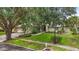 Beautiful home with manicured lawn, mature trees, and a well-maintained exterior at 16804 Windsor Park Dr, Lutz, FL 33549