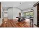 Bright living room features recessed lighting, wood floors, and a sliding door to the backyard pool at 16804 Windsor Park Dr, Lutz, FL 33549
