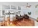 Bright living area with hardwood flooring, vaulted ceilings, and an open floorplan at 16804 Windsor Park Dr, Lutz, FL 33549