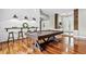 Spacious living room featuring a pool table, hardwood floors, and access to the outdoor area at 16804 Windsor Park Dr, Lutz, FL 33549