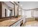 Beautiful main bathroom featuring double sinks, granite counters, a large tub, and separate glass enclosed shower at 16804 Windsor Park Dr, Lutz, FL 33549
