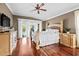 Serene main bedroom with hardwood floors and access to screened pool area at 16804 Windsor Park Dr, Lutz, FL 33549