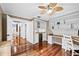 Home office with built-in desk, shelving, wine fridge and access to other rooms at 16804 Windsor Park Dr, Lutz, FL 33549