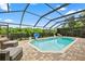 Inviting screened-in pool with brick pavers and ample lounge space at 16804 Windsor Park Dr, Lutz, FL 33549