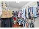 Walk-in closet with white wire shelving and clothing racks for ample storage at 16804 Windsor Park Dr, Lutz, FL 33549