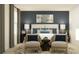 Comfortable main bedroom featuring a plush bed, stylish decor, and soft lighting at 208 27Th Se St, Ruskin, FL 33570