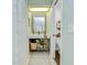 Stylish bathroom featuring modern vanity, mirror, and a view into the toilet room at 2139 Elm St # 308, Dunedin, FL 34698
