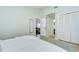 Clean bedroom showcasing a comfortable bed and closet space, with a view into other rooms at 2139 Elm St # 308, Dunedin, FL 34698