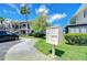 Well-maintained condo complex with manicured lawns, mature trees, and convenient parking at 2139 Elm St # 308, Dunedin, FL 34698