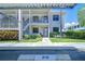 Charming two-story condo building with well-maintained landscaping and covered parking at 2139 Elm St # 308, Dunedin, FL 34698