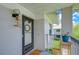 Inviting front porch with decorative accents and ample space for relaxing outdoors at 2139 Elm St # 308, Dunedin, FL 34698