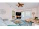 Cozy living room with stylish rug, comfortable seating, and ceiling fan, creates an inviting atmosphere at 2139 Elm St # 308, Dunedin, FL 34698