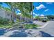 Condo building with covered parking and mature trees at 2139 Elm St # 308, Dunedin, FL 34698