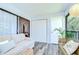 Cozy patio featuring comfortable seating, ample natural light, a storage closet, and a view through a glass door at 2139 Elm St # 308, Dunedin, FL 34698