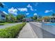 Resort-style pool area with plenty of seating and mature landscaping at 2139 Elm St # 308, Dunedin, FL 34698