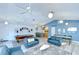 Spacious recreation room featuring a pool table, seating, and kitchenette at 2139 Elm St # 308, Dunedin, FL 34698