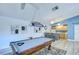 Recreation room features a pool table, bar seating and small kitchenette at 2139 Elm St # 308, Dunedin, FL 34698