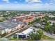 Aerial shot showcasing the neighborhood with beautiful trees, surrounding streets and nearby amenities and ocean views at 2505 W Azeele St, Tampa, FL 33609