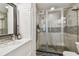 Bright bathroom featuring glass shower, sleek vanity, and modern fixtures at 2505 W Azeele St, Tampa, FL 33609