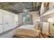 Serene bedroom with plush bed, soft lighting, and exposed ceiling at 2505 W Azeele St, Tampa, FL 33609