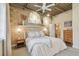 Cozy bedroom with view to ensuite bathroom, textured walls and modern decor at 2505 W Azeele St, Tampa, FL 33609