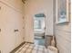 Hallway view of a bedroom, featuring a minimalist design with a neutral color palette and natural light, creating a serene atmosphere at 2505 W Azeele St, Tampa, FL 33609