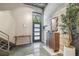 Bright entryway features modern door, concrete floors, and sleek storage at 2505 W Azeele St, Tampa, FL 33609