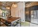 Open concept kitchen with stainless steel refrigerator, center island, and access to the living area at 2505 W Azeele St, Tampa, FL 33609