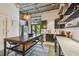 Modern kitchen with a central island, stainless steel appliances, and industrial-style design, next to outdoor patio at 2505 W Azeele St, Tampa, FL 33609