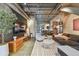 Bright, open-concept living room with neutral tones, polished concrete floors, and modern furnishings and decor at 2505 W Azeele St, Tampa, FL 33609