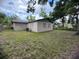 Spacious backyard with a well-manicured lawn and a sturdy fence, creating a safe and enjoyable outdoor area at 2713 W Chestnut St, Tampa, FL 33607
