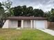 Charming single-story home featuring a well-manicured lawn and a one-car garage at 2713 W Chestnut St, Tampa, FL 33607
